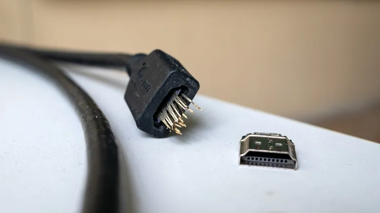 A physical monitor showing a Homarr dashboard, running directly from a Proxmox LXC.